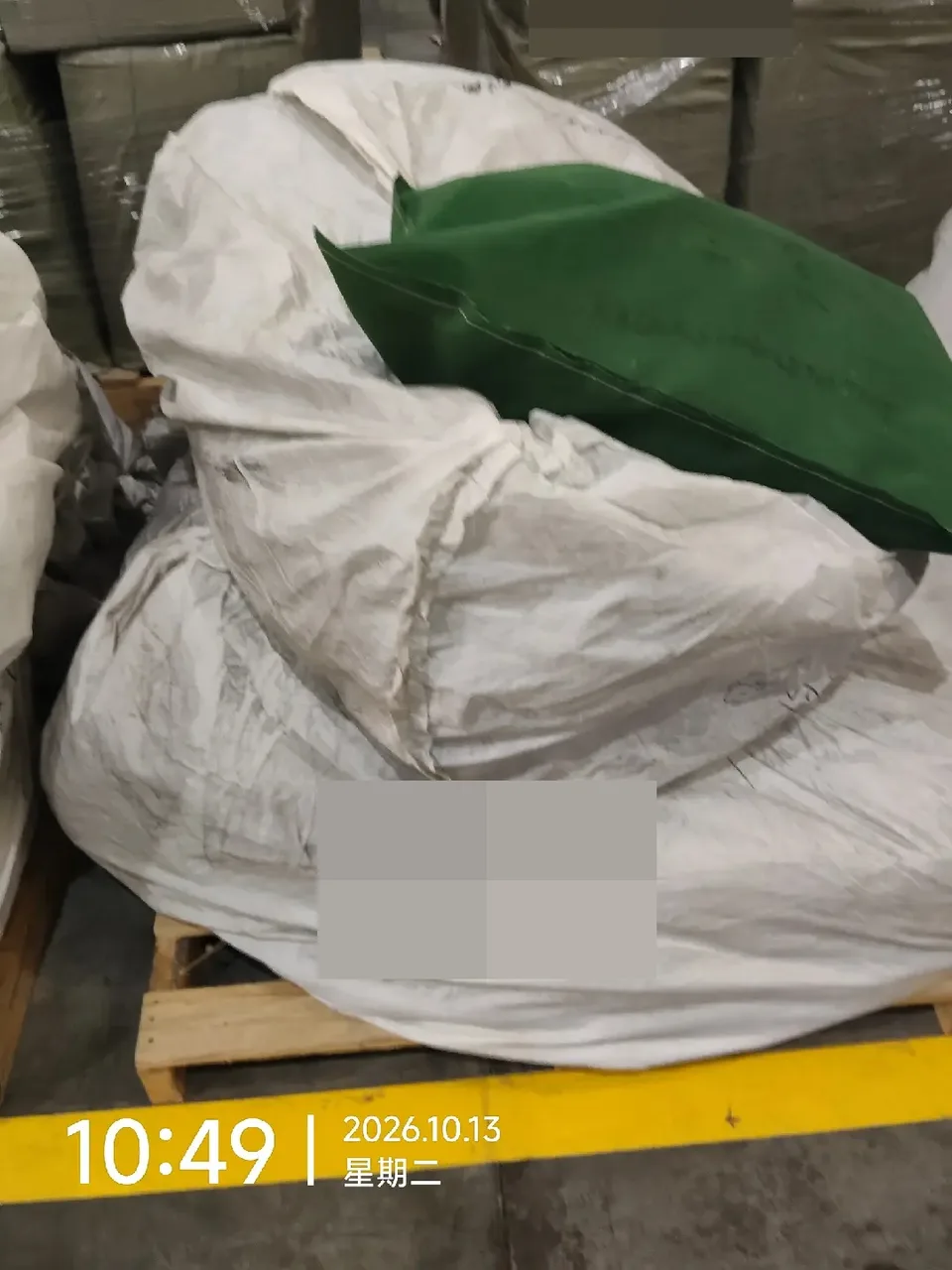 Folded green tent material visible inside an open white package