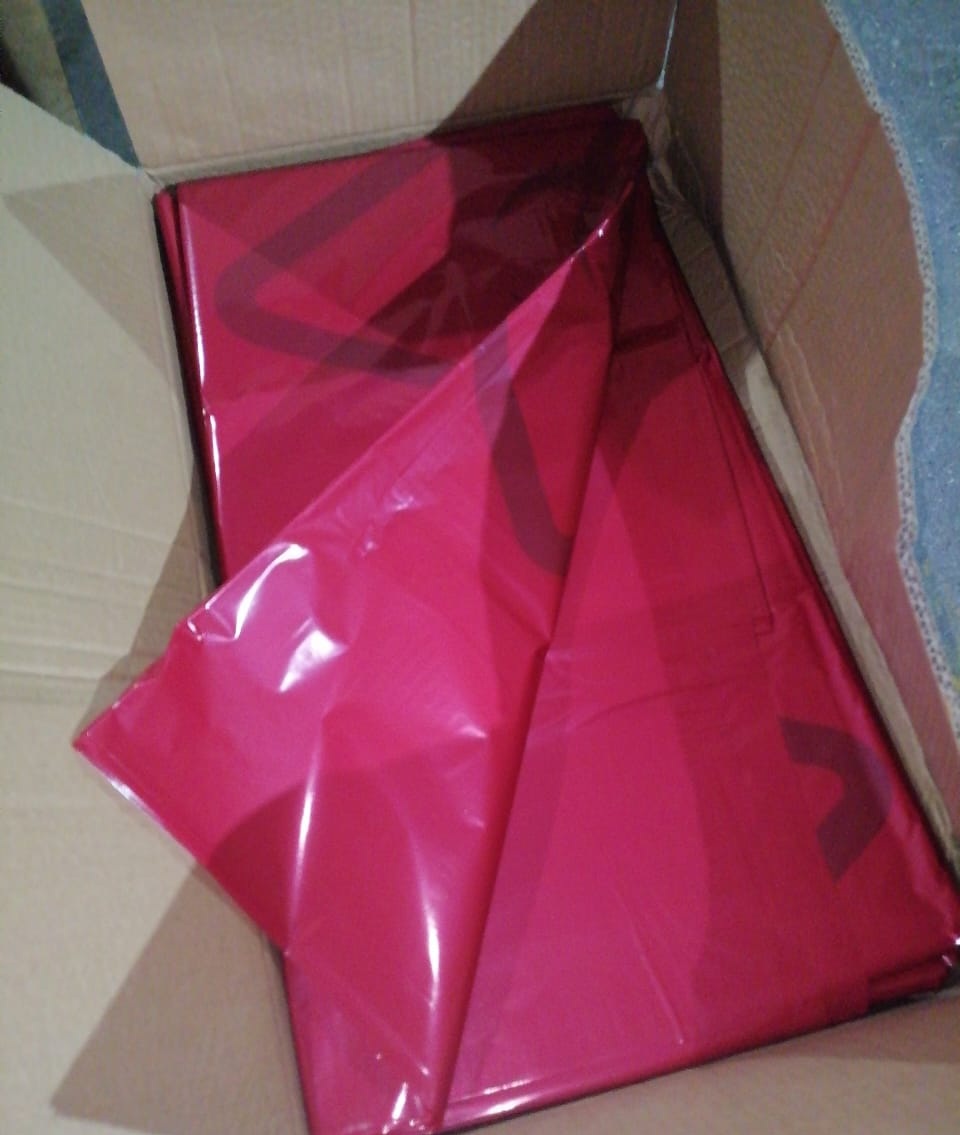 Actual red biohazard bags photographed before shipment